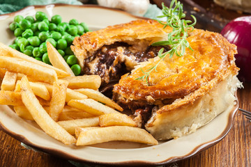 Homemade beef stew pie with french fries