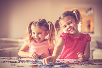 Fototapeta premium Sisters time. Little girls playing.