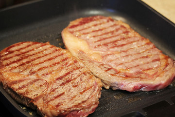 Two steaks cooked on the pan