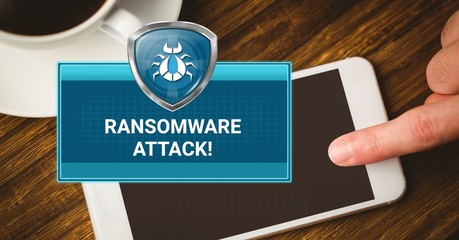 Ransomware attack box and hand touching phone