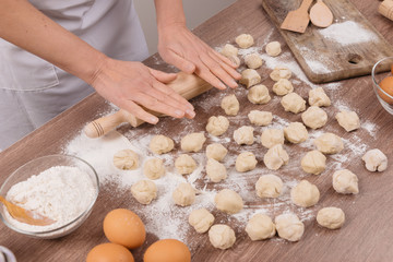 Preparing, cooking, making homemade ravioli, pelmeni or dumplings with meat