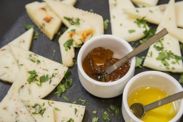Traditional italian aperitif with proscioutto, mortadella sausage, cheese and aperol spritz drink