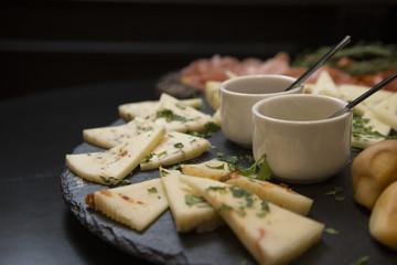 Traditional italian aperitif with proscioutto, mortadella sausage, cheese and aperol spritz drink