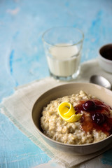 Oatmeal porridge with butter and cherry jam