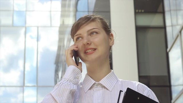 Energetic Woman Talking by Phone