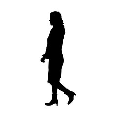 Silhouette of walking woman.