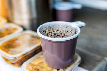 Tea in plastic cup close