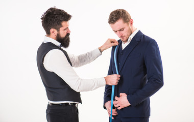 Businessman, client on strict face visit tailor salon.