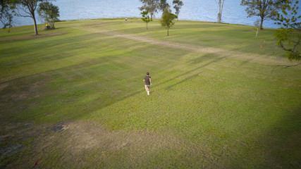 Aerial drone view of man running in the Scenic Rim, Queensland, Australia