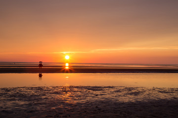 Lone person watching beach sunset