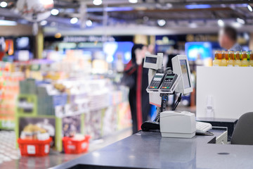 Cash desk with card payment terminals on blurry background