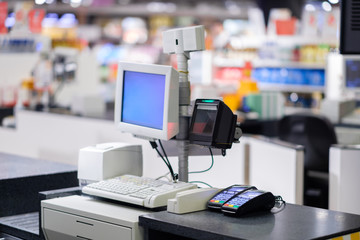 Cash desks with card payment terminals on blurry background