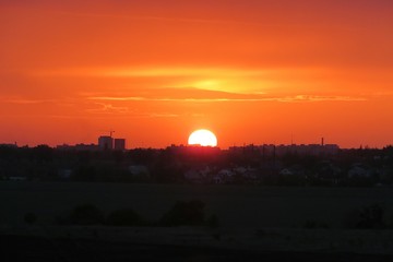 Beautiful fiery orange sunset over the city