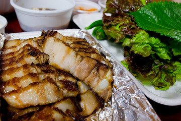 Barbecue Bossam, Korean Delivery Food. Bossam : boiled pork eaten with a salty sauce and wrapped in greens.