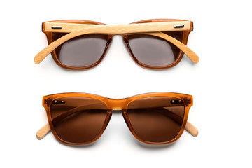 Two sunglasses with front and back side isolated on white background.