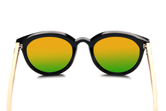 Stylish sunglasses with multicolored lenses isolated on white background.