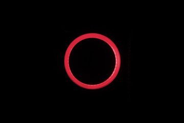 Red neon circle isolated on black background
