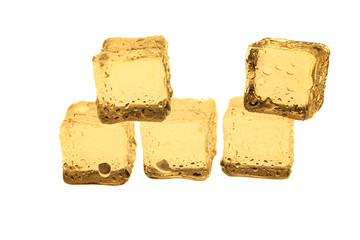 Golden ice cubes on white background.