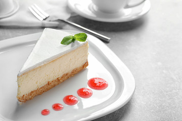 Delicious cheesecake served with sweet jam on plate