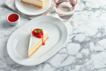 Delicious cheesecake served with sweet jam on plate