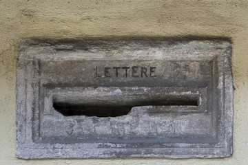 Old stone letterbox with the inscription Letter in Italian