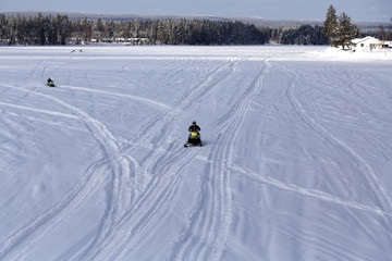 Group of snow mobiles on the river