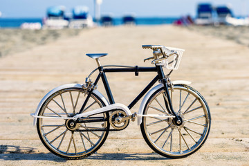 Fototapeta na wymiar Daylight view to handicraft bicycle souvenir on wood pier