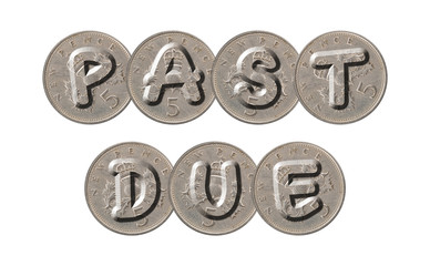 PAST DUE written with old British coins on white background