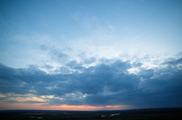 Sunset over the river and meadow.
