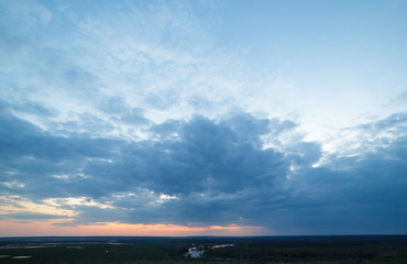 Sunset over the river and meadow.