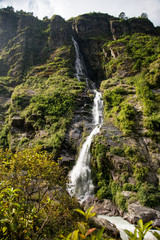 Naklejka na ściany i meble Scenic Himalayan Landscape. View of Waterfall, Mountains and forest. Annapurna Range on Annapurna Circuit Trek. Autumn season in Nepal, Asia.