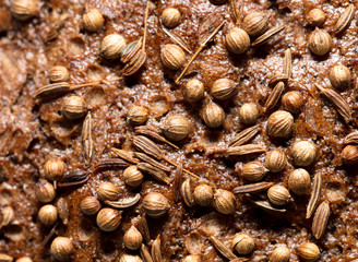 sesame seeds on black bread as a background