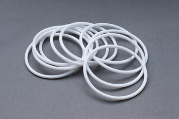 Teflon ring seals on gray background
