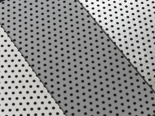 Metal acoustic panels with round perforation. Grey texture