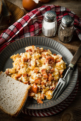 Scrambled eggs with sausage.