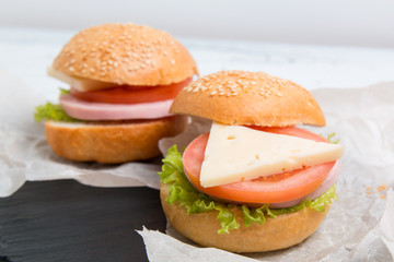 baguette sandwich with ham, cheese, tomatoes and lettuce