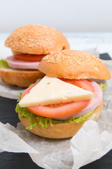 baguette sandwich with ham, cheese, tomatoes and lettuce