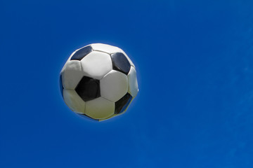 Fototapeta na wymiar football ball is flying in the sky