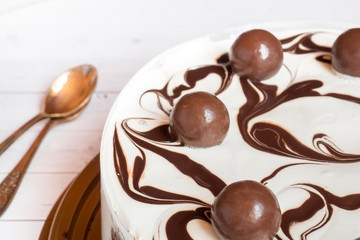 Delicious easy ice cream cake with chocolate on a light backgrou