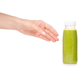 Bottle of smoothies green in hand