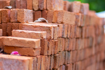 Red bricks on building. On blurred background