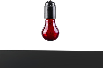 red light bulb on a white background