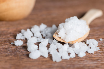Sea salt in wood spoon.