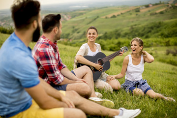 Group od young people having fun on a trip in nature