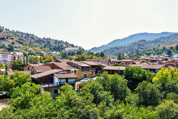 Fototapeta na wymiar Daylight view from above to city buildings and Troodos Mountains