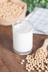 Soy milk and Soy bean on wooden background.