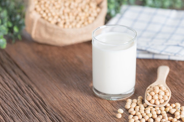 Soy milk and Soy bean on wooden background.