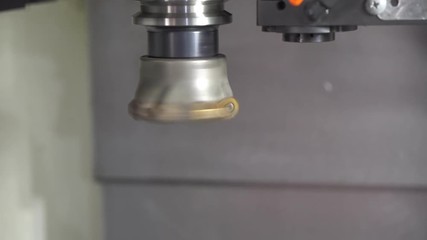 Closeup of the spindle of CNC milling machine attach the index-able tool.The CNC machine spindle dry run with index-able tool. - Powered by Adobe