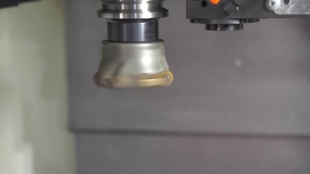 Closeup of the spindle of CNC milling machine attach the index-able tool.The CNC machine spindle dry run with index-able tool.