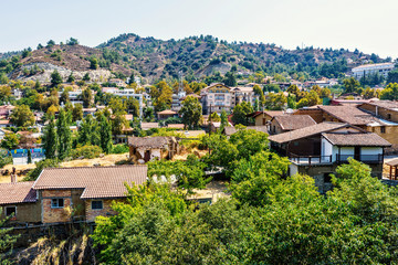 Fototapeta premium Daylight view from above to city buildings and Troodos Mountains